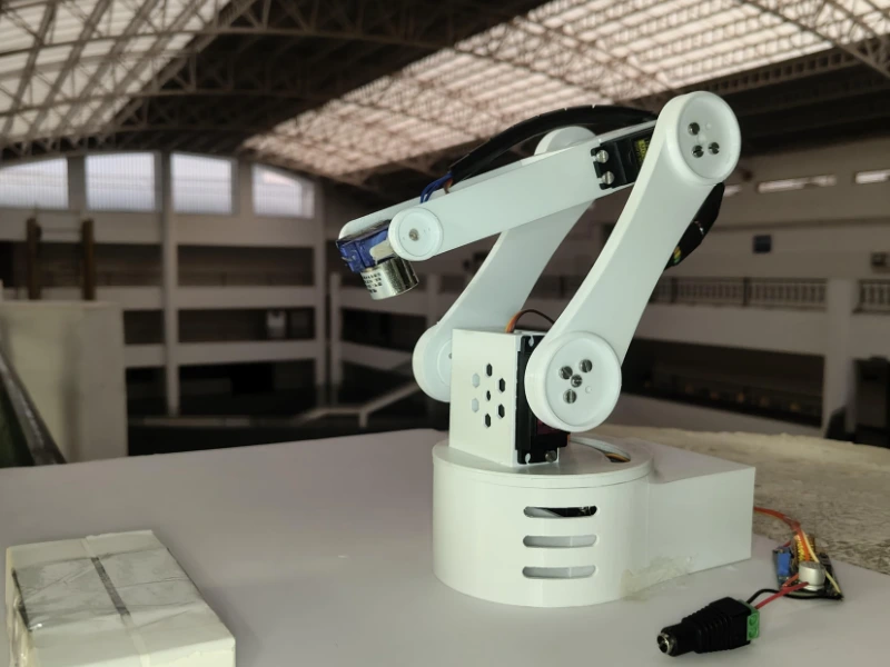 Intelligent Automated Package Handling System - Electromagnet-based robotic arm